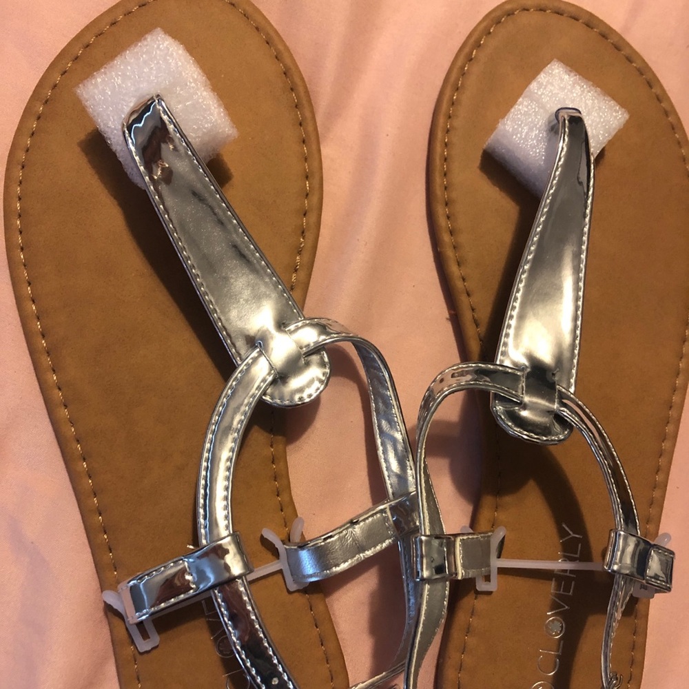 Size 8 1/2 Cloverly shiny silver sandals. Never worn!